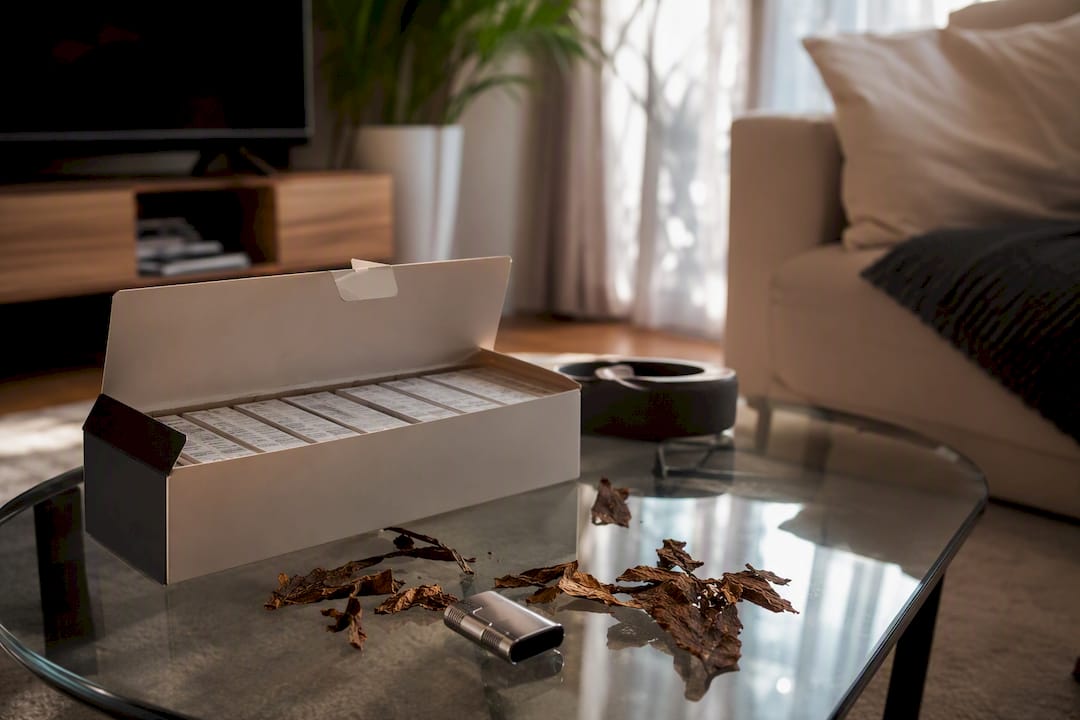 Partially opened cigarette carton on marble counter