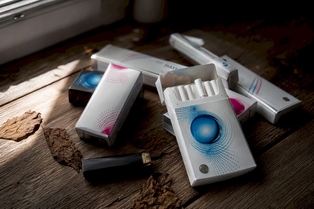 Close-up of slim menthol cigarette packs with capsule filters